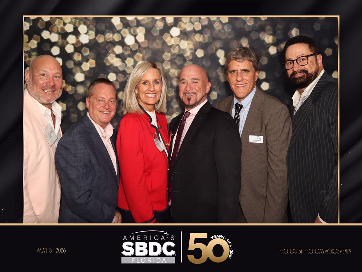 Group of attendees at the America SBDC 50th Anniversary using the Infinite Magic Photo Booth Rental by Photo Magic Events