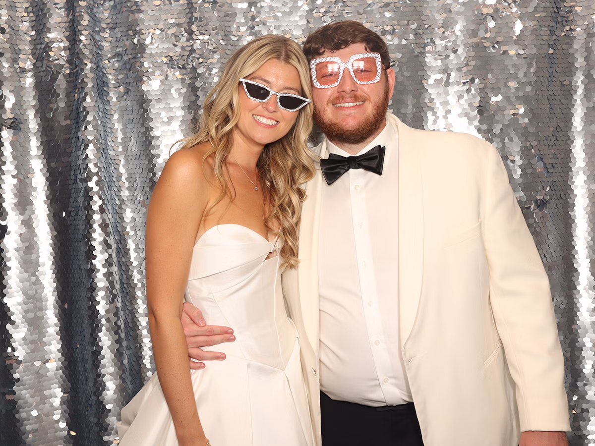 Bride and Groom taking a moment for a picture in their Wedding Photo Booth Rental