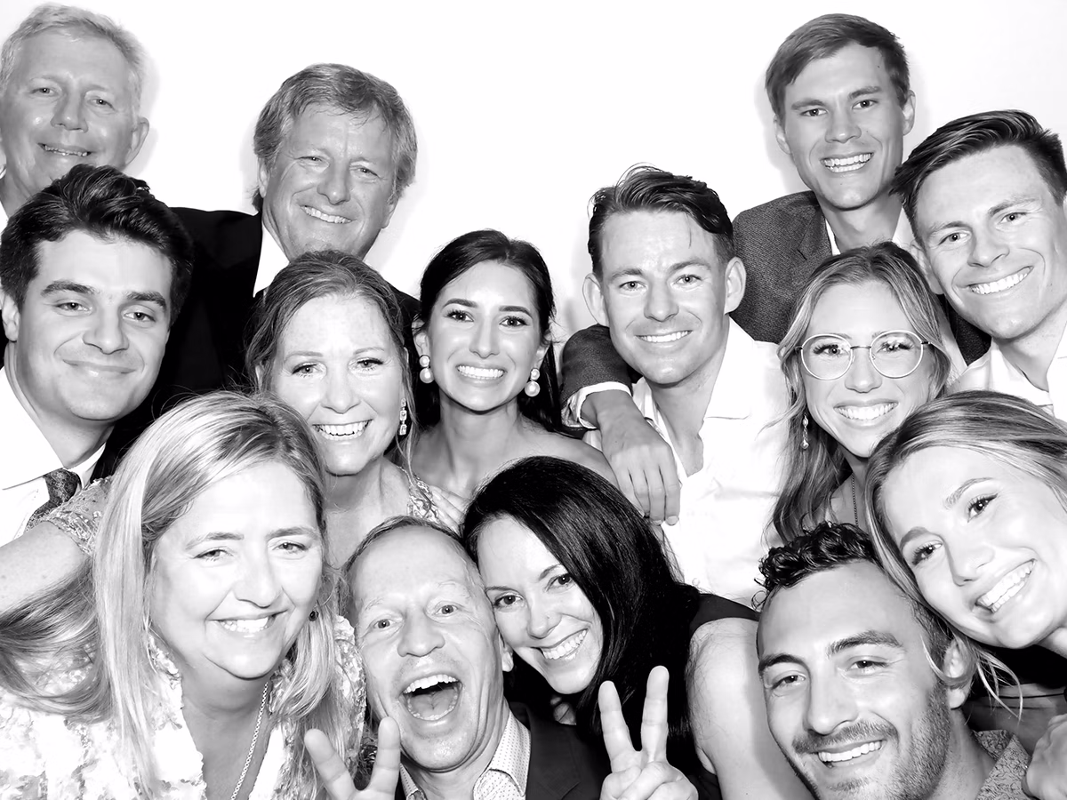 Large group of people at a wedding using the Infinite Magic Photo Booth Rental