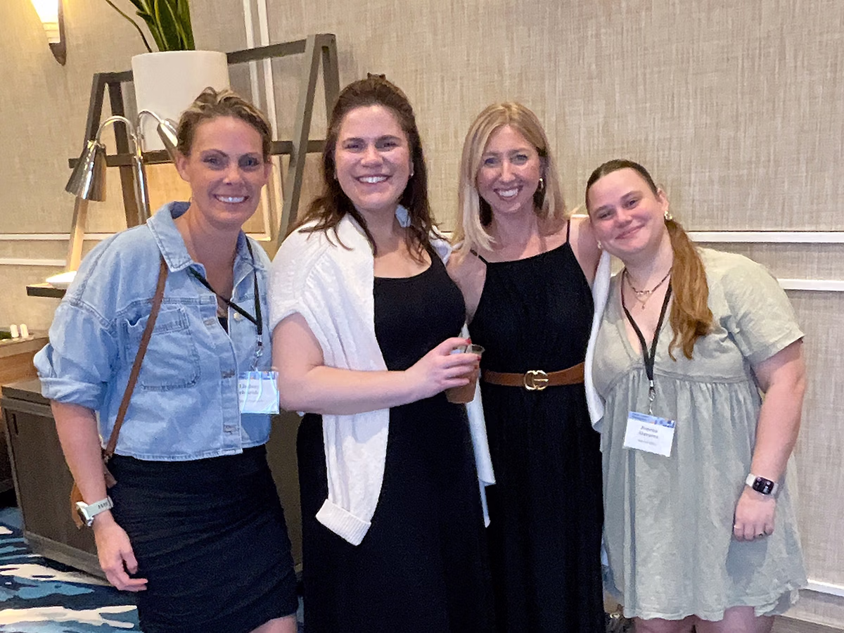 Roaming Magic Photo Booth Rentals capturing a group of attendees at a tradeshow event in Southwest Florida | Photo Magic Events