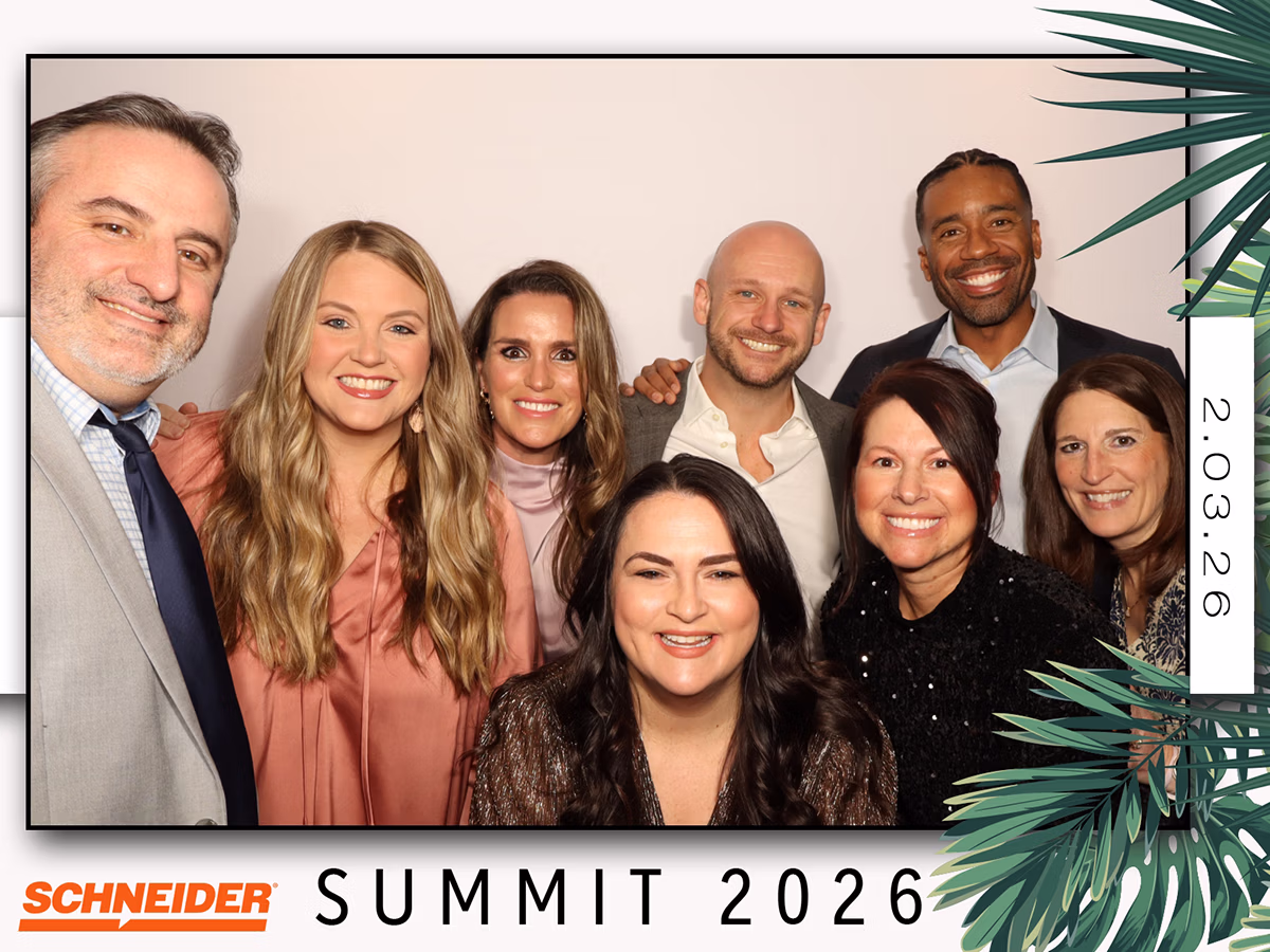 Group of attendees at the Scheider Summit 2026 corporate event using a corporate event photo booth rental by Photo Magic Events
