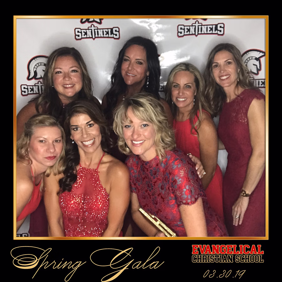Group of faculty members of the Evangelical Christian School at the Spring Gala using the DIY Magic Photo Booth Rental